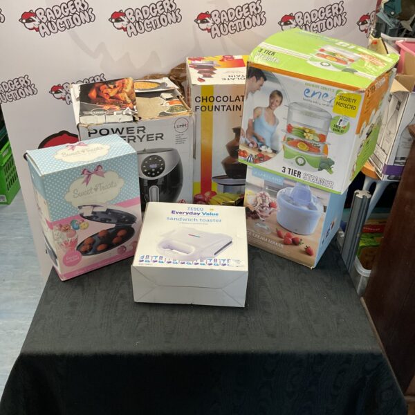 Boxed kitchenware bundle including air fryer, chocolate fountain and toaster.