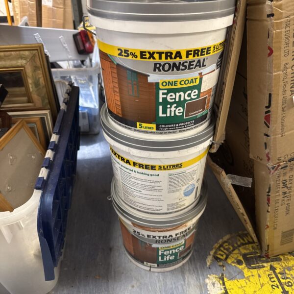Three tubs of Ronseal Country Oak fence paint for garden use.