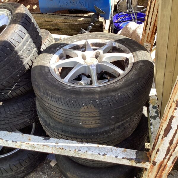 Set of four used alloy wheels with tyres.