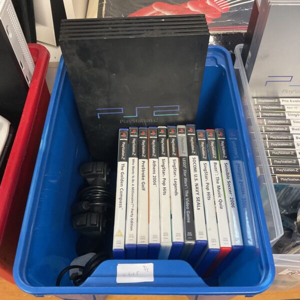 Sony PlayStation 2 console with games, retro gaming bundle.