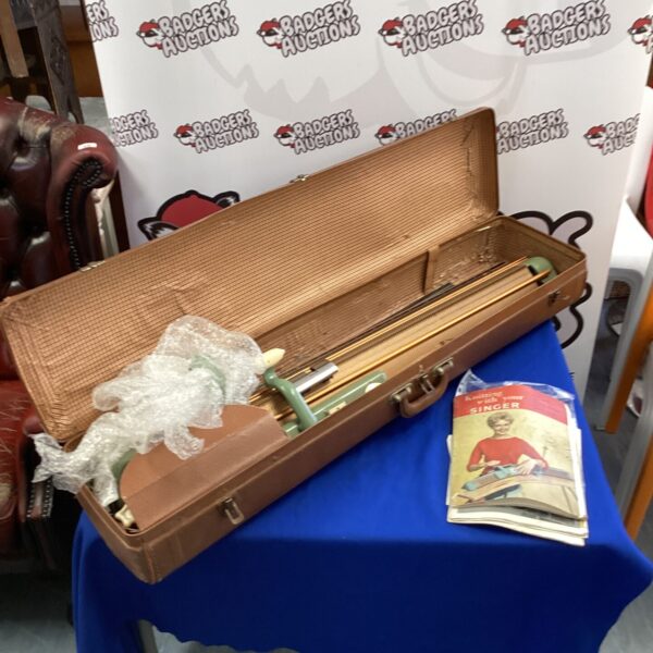 Vintage Singer knitting machine in its original carrying case.