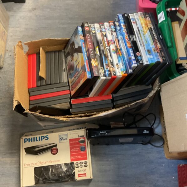 Freesat TV box and collection of children’s DVDs for family entertainment.