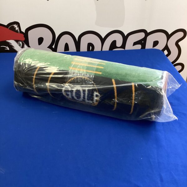 Rolled golf putting mat for indoor practice.