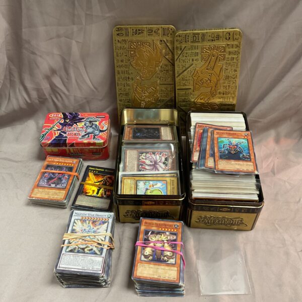 Large collection of Yu-Gi-Oh trading cards with rare and holo cards.