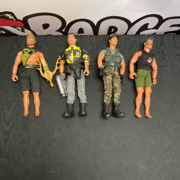 Lot of four vintage Action Man figures in military uniforms.