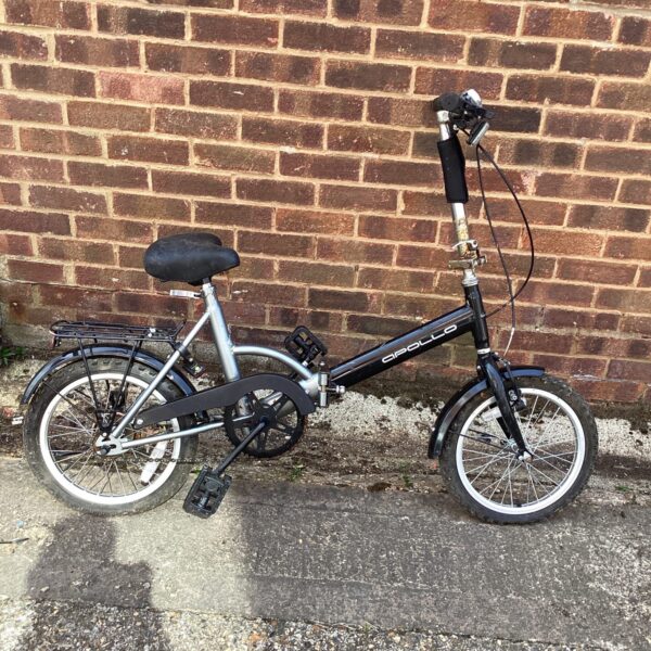 Side view of a vintage Apollo folding bike with mudguards.
