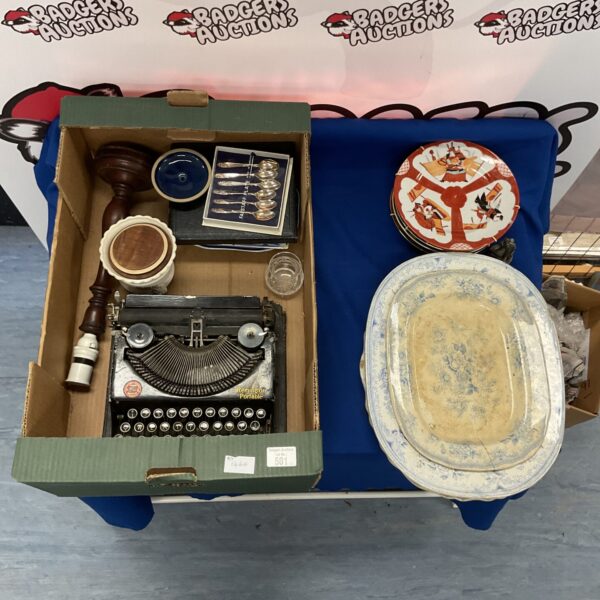 Vintage Remington typewriter with collector's plates and china.