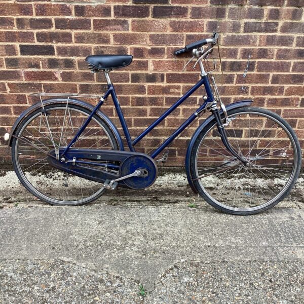 Side view of a vintage Hunter bicycle in blue.