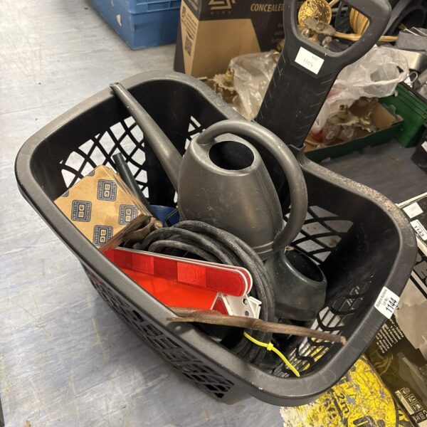 Wheeled basket filled with a shed clearance lot of tools and hardware.