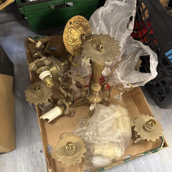 Vintage brass chandeliers lot with ornate detailing.