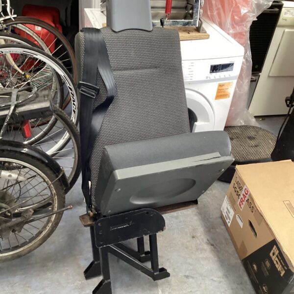 Side view of a used van folding seat for vehicle conversions.