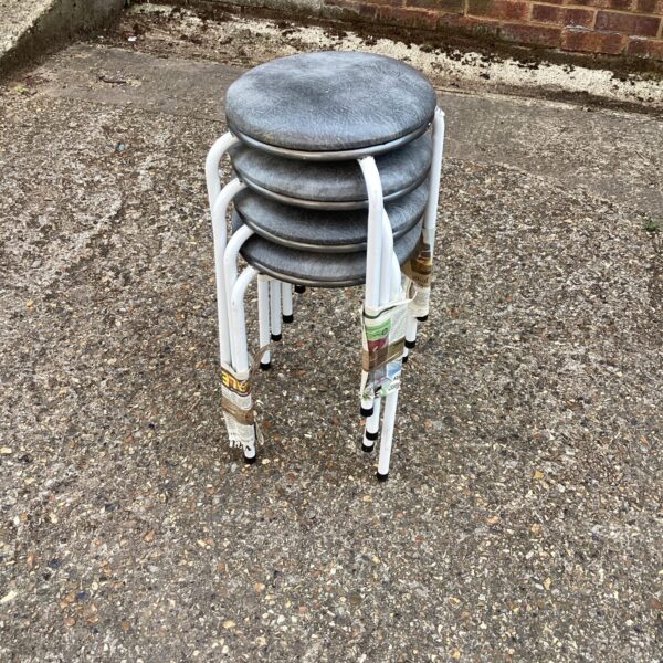 Lot of four vintage stacking stools for kitchen or dining use.