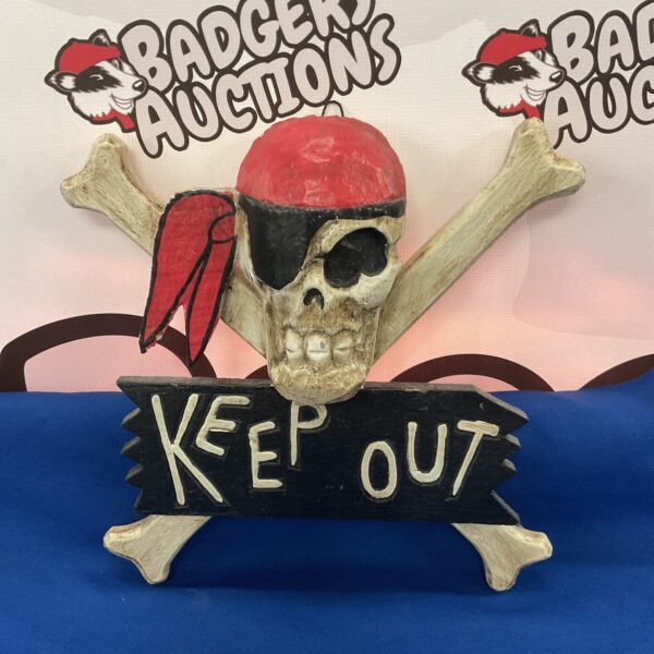 Vintage wooden keep out skull plaque for nautical decor.
