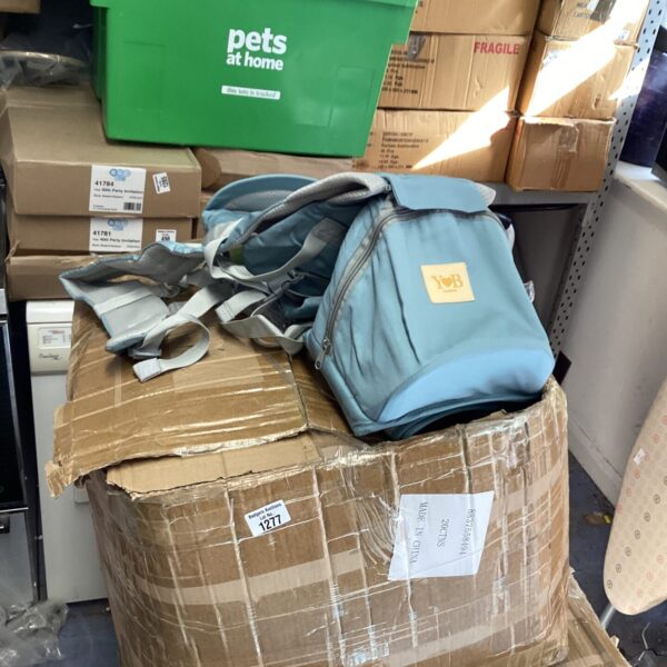 Three boxes of YB baby carrier harnesses for infants.
