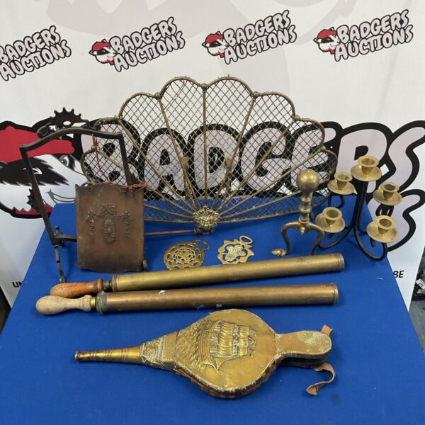 Vintage brass and copper lot featuring lion head fireguard and gong.