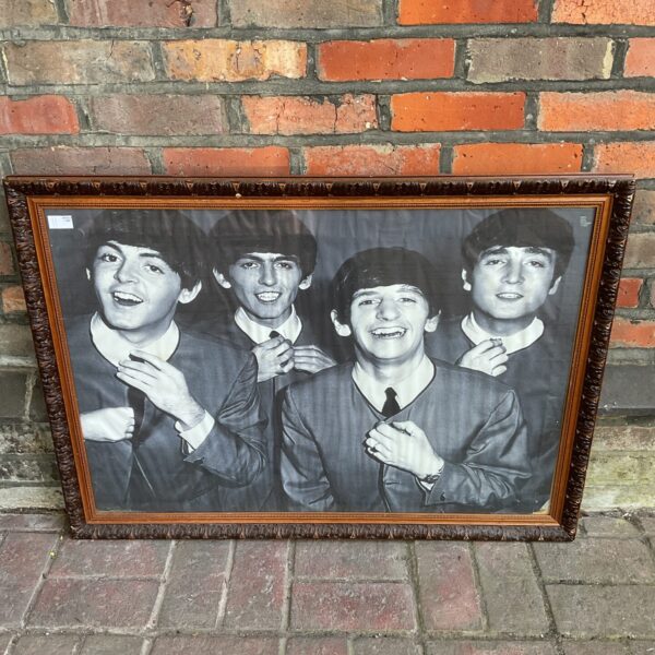 Large framed black and white print of The Beatles, a classic band photograph.