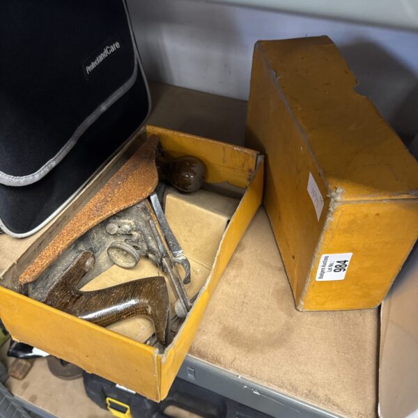Vintage Stanley wood plane with wooden body and metal blade.