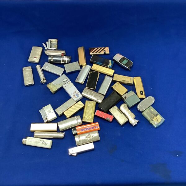 Vintage lighter collection lot with various styles and finishes.