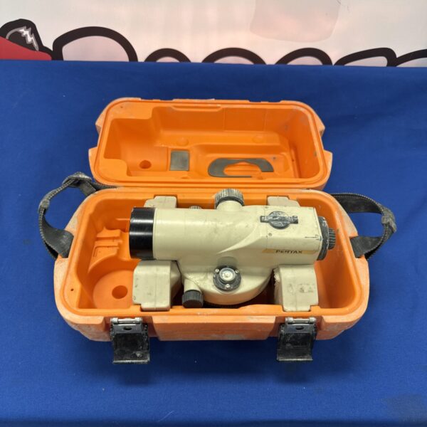 Vintage Pentax theodolite in orange case, surveying equipment.
