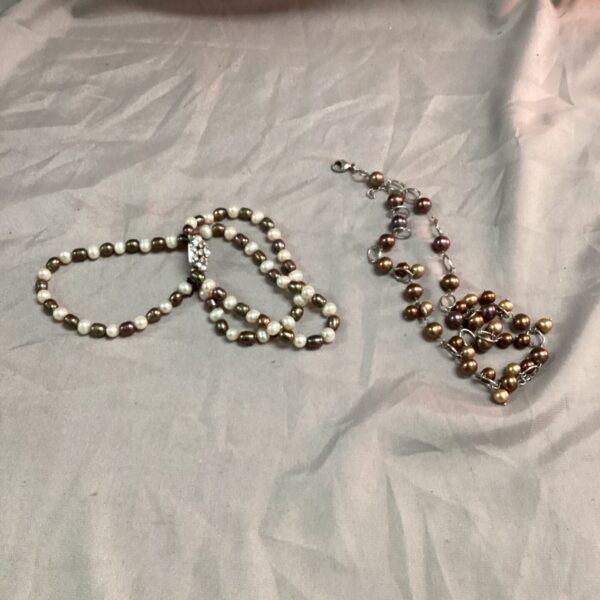 Vintage pearl necklace and bracelet set with bronze and white pearls.