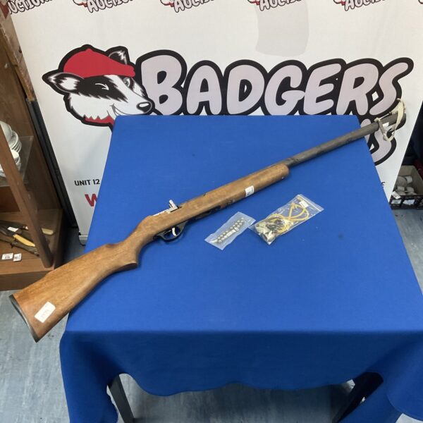 Vintage catapult rifle with spare rubbers and ammunition for target practice.