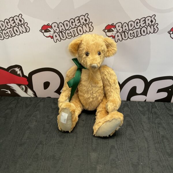 Vintage articulated teddy bear, classic plush toy for collectors.