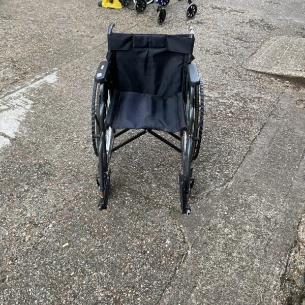 Black folding aid wheelchair for mobility assistance.