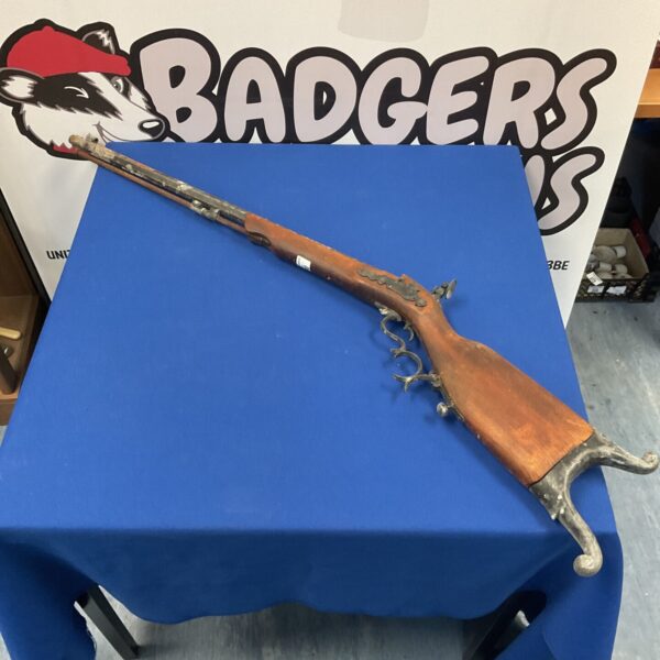 Antique flintlock musket rifle for collectors and wall display.