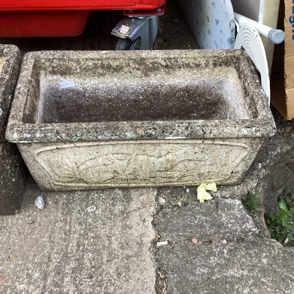 Rectangular stone effect garden planter for outdoor use.