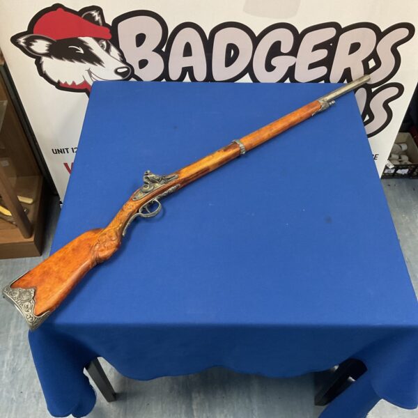 Antique flintlock musket displayed for collectors and historical enthusiasts.