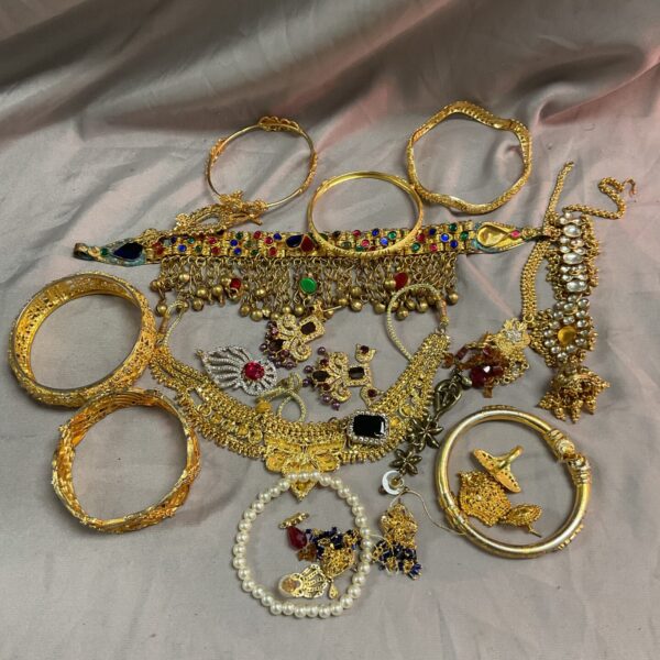 Tray of vintage Indian jewellery with colourful glass stones.