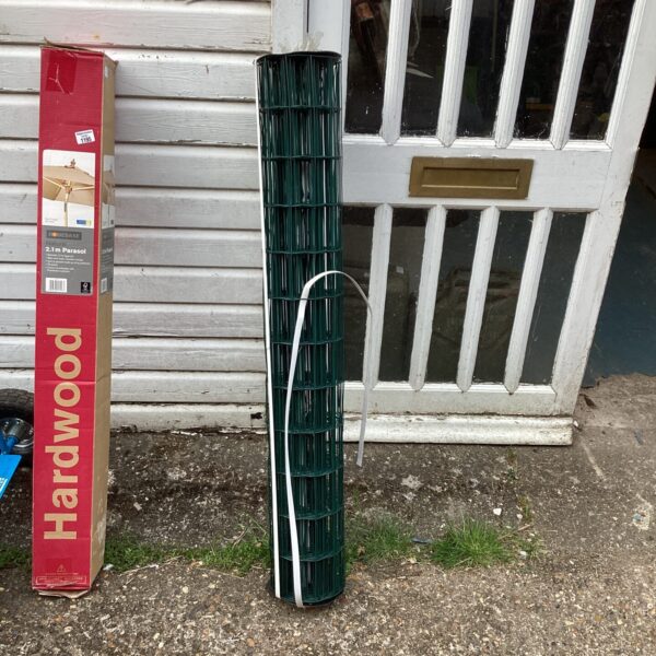 Roll of mesh garden fencing for boundary screening.