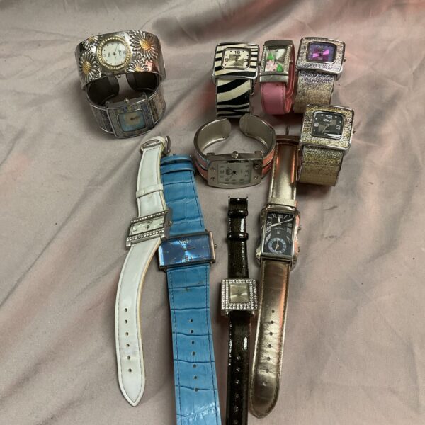 Tray of assorted wristwatches and bracelets, vintage style timepieces.