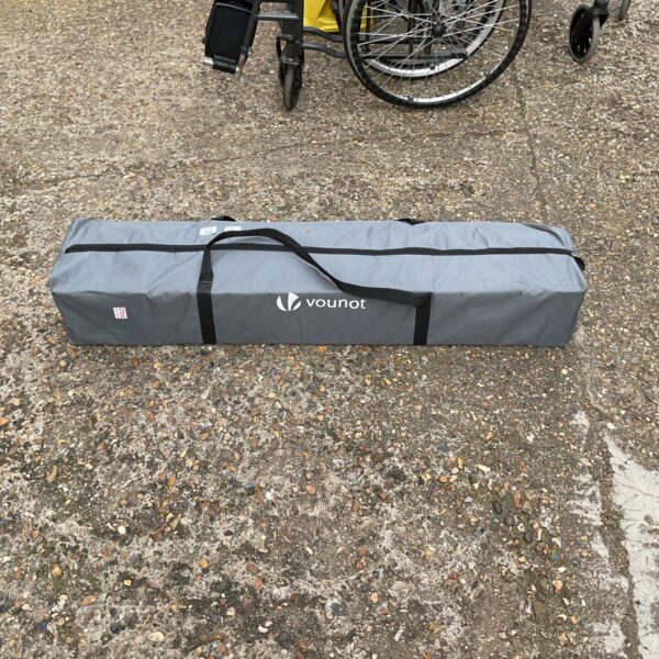 Collapsed Vounot telescopic gazebo ready for storage or transport.