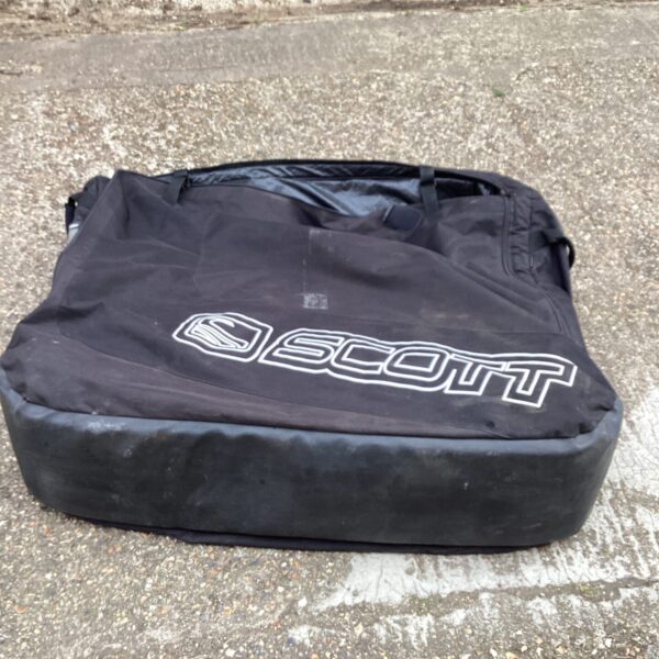 Front view of a used Scott bike carry case.