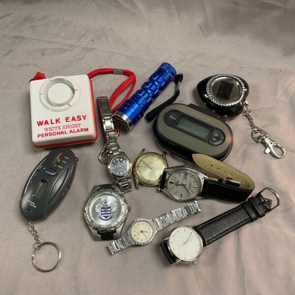 Mixed lot of personal alarm, torch, and wristwatches for collectors.