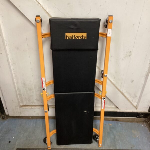 Halfords mechanics crawler board with wheels for garage use.