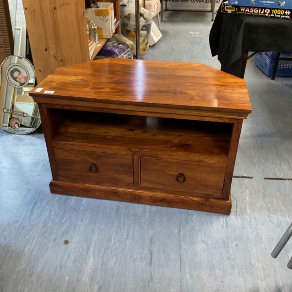 Front view of a solid oak media cabinet with warm wood tone.