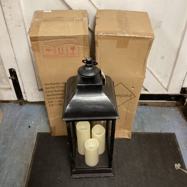 Lot of three large black LED plastic lanterns for garden lighting.