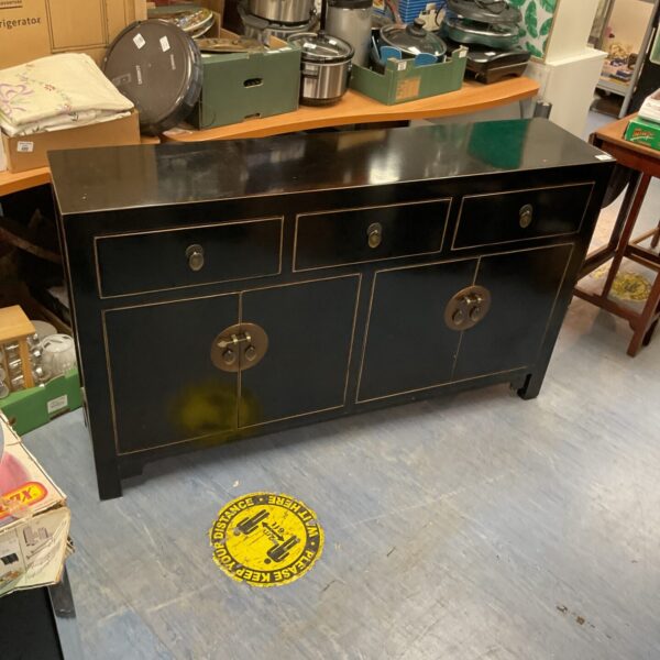 Black lacquered Japanese sideboard with drawers and cabinets.