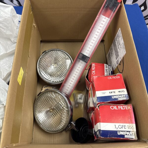 Pair of vintage Lucas spot lamps in a cardboard box.