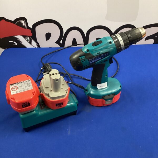 Makita 18V cordless drill with batteries and charger.