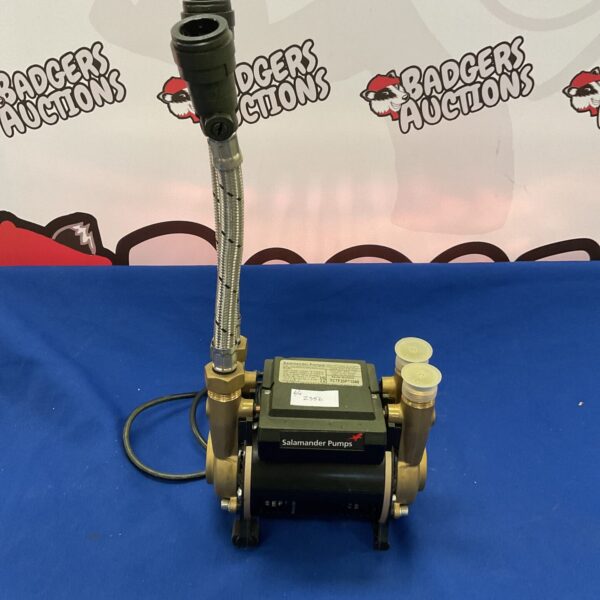 Front view of a used Salamander shower pump unit.