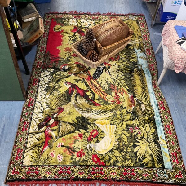 Vibrant vintage floral rug with detailed woven pattern.
