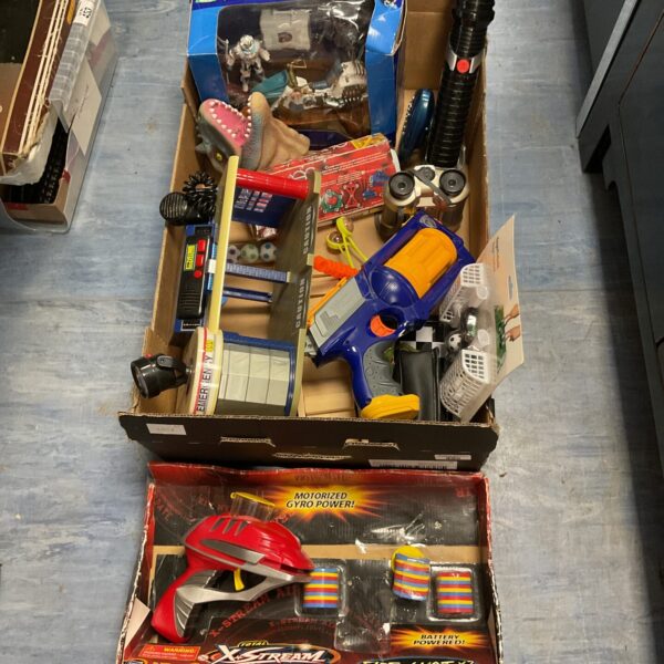 Vintage toy lot featuring X Stream air gun and electronic garage.