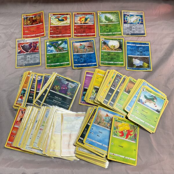 Large lot of Pokemon trading cards for collectors and fans.