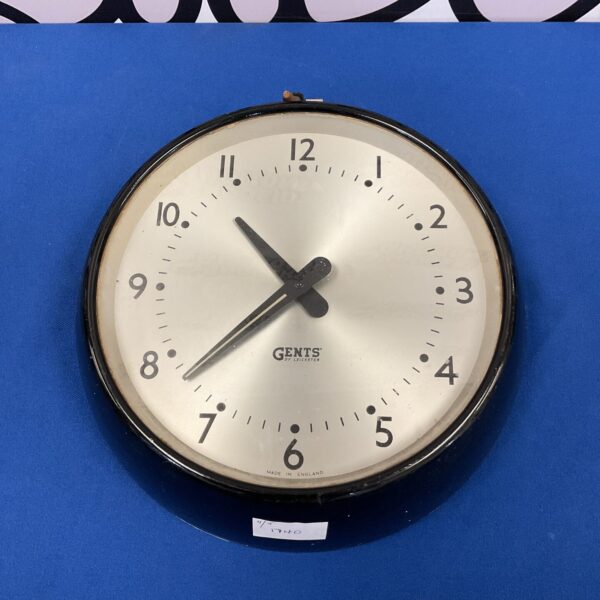 Vintage Gents slave clock with bold white face and black numerals.