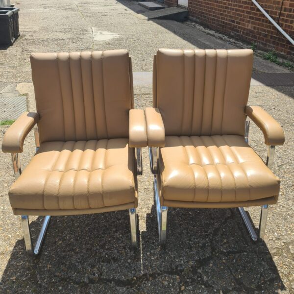 Two Verco 1970s chrome and tan leather office chairs