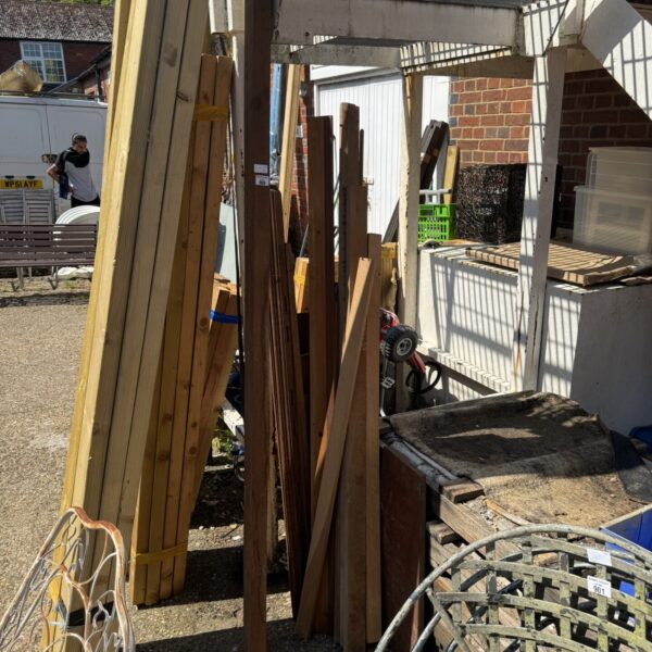 Bundle of assorted timber lengths for DIY projects and construction.