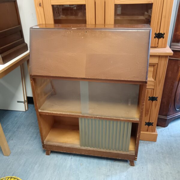 Vintage writing cabinet with glass front and wooden cupboard.